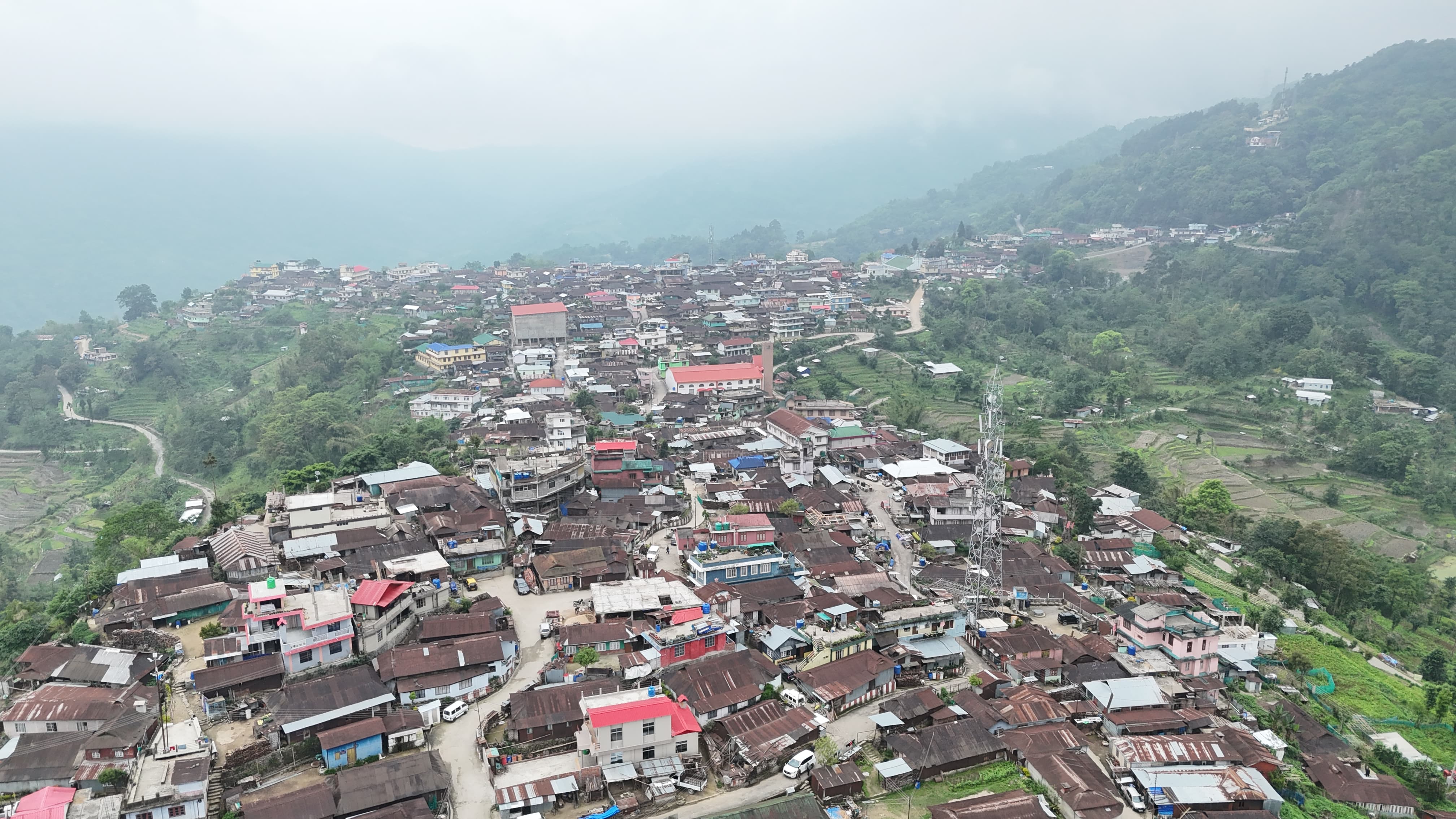 Closer aerial view of Viswema's homes lining the ridge