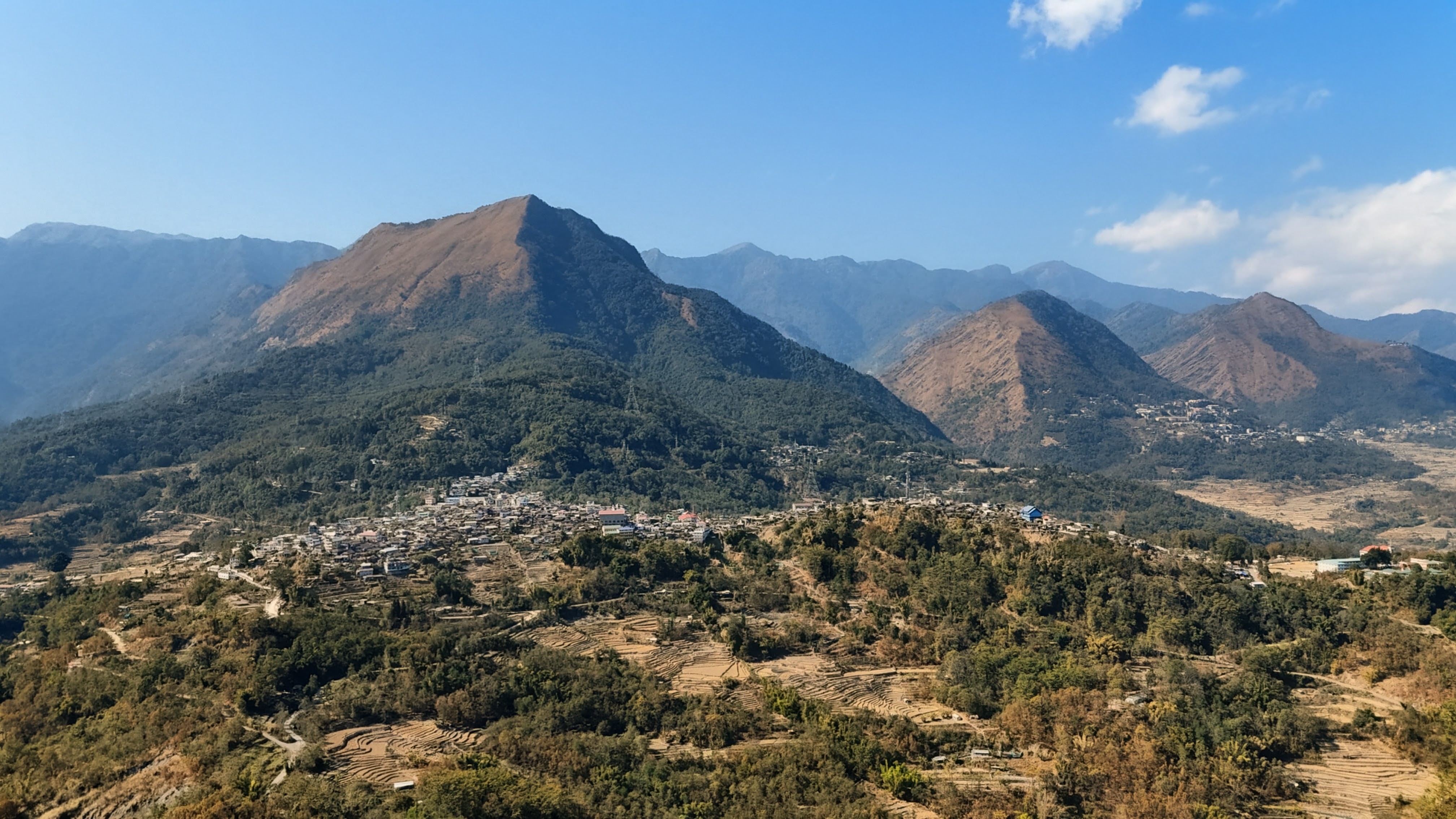 Aerial view of Viswema village spread across a mountain ridge in Nagaland